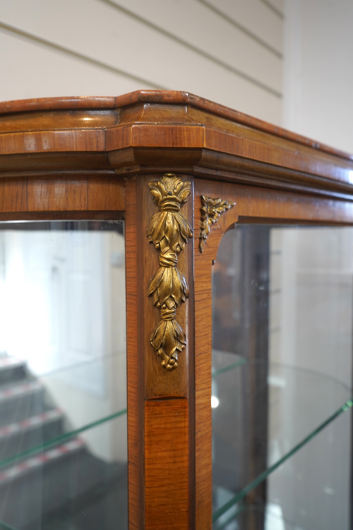 A Louis XVI style marquetry inlaid, gilt metal mounted kingwood vitrine